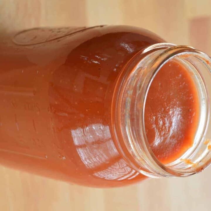 mason jar with marinara sauce in it.