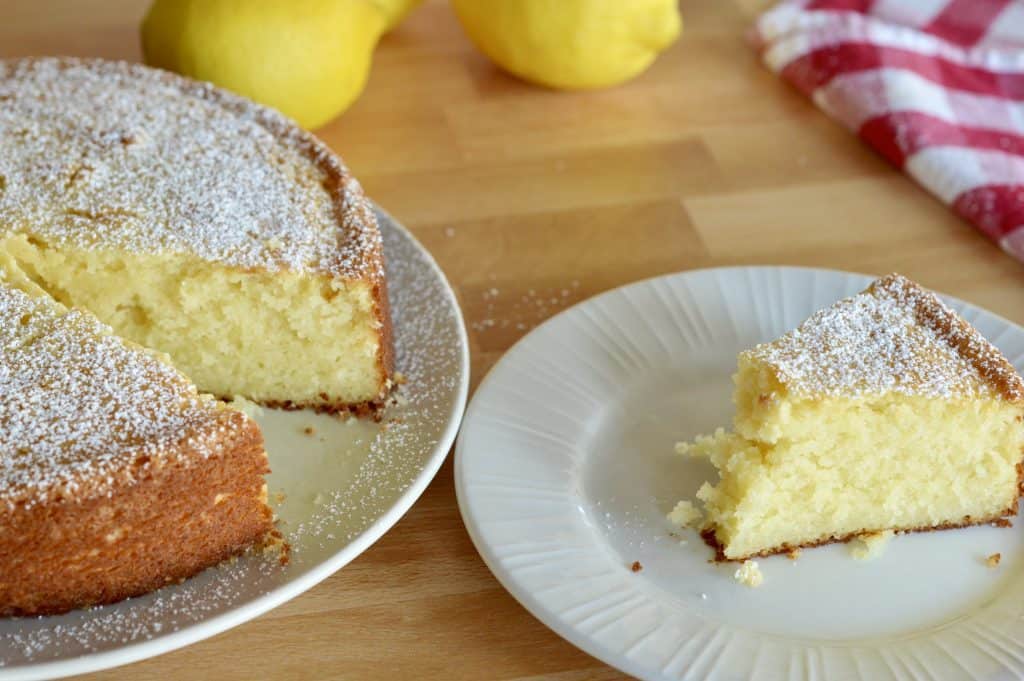 Italian Lemon Ricotta Cake on a white plate. 