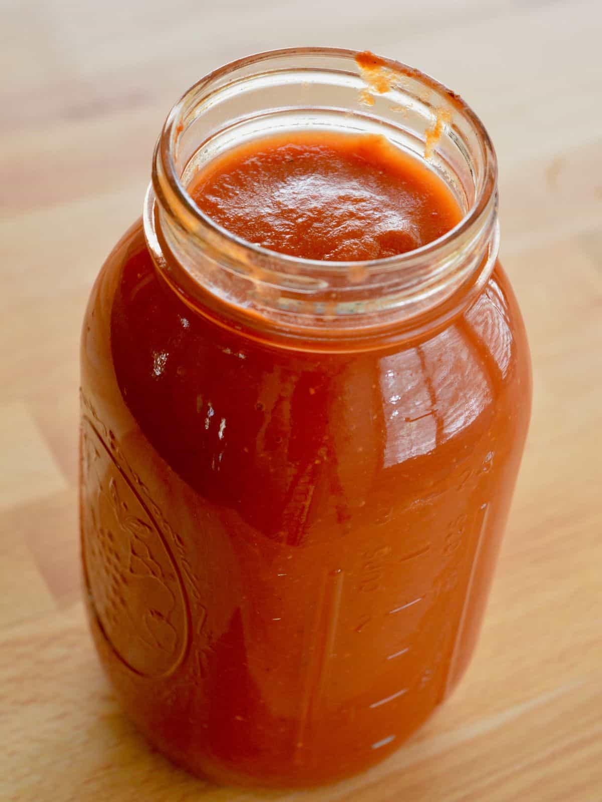 Simple Marinara Sauce in a jar on a countertop.