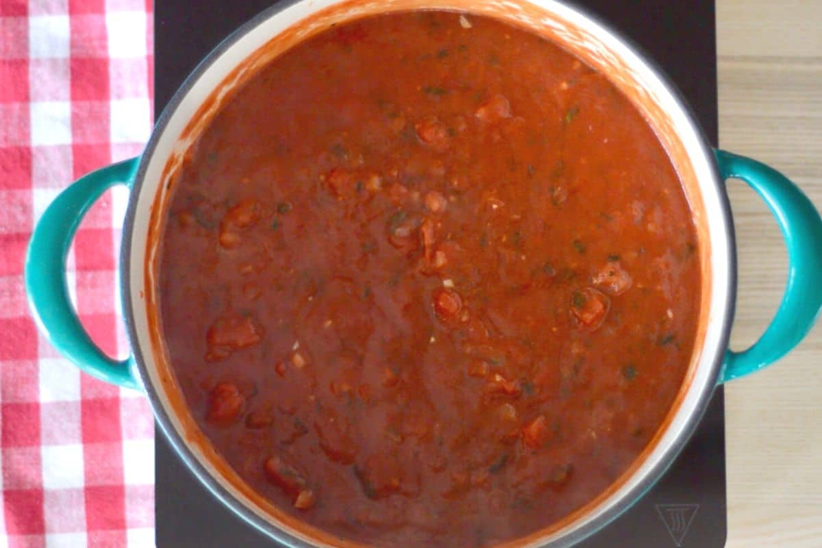 overhead photo of ingredients for sauce on a stovetop.