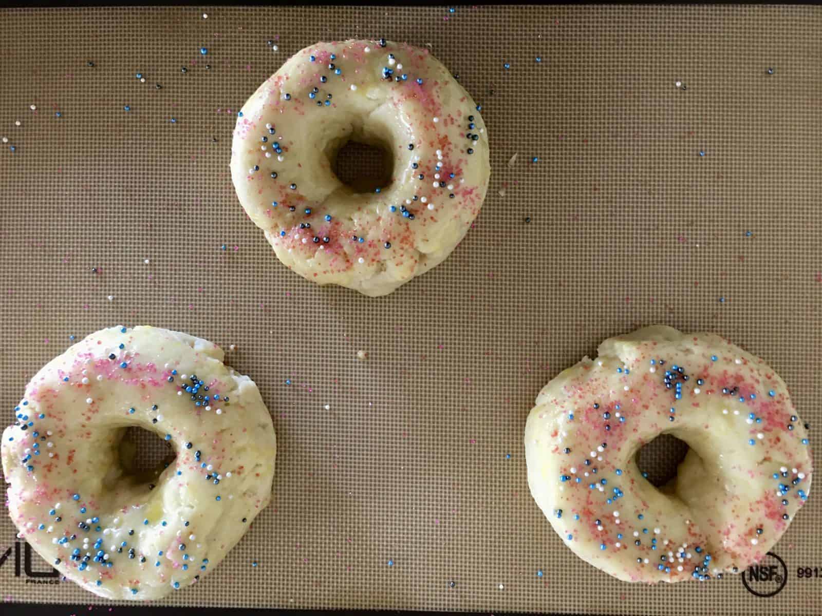 donut bread topped with sprinkles. 