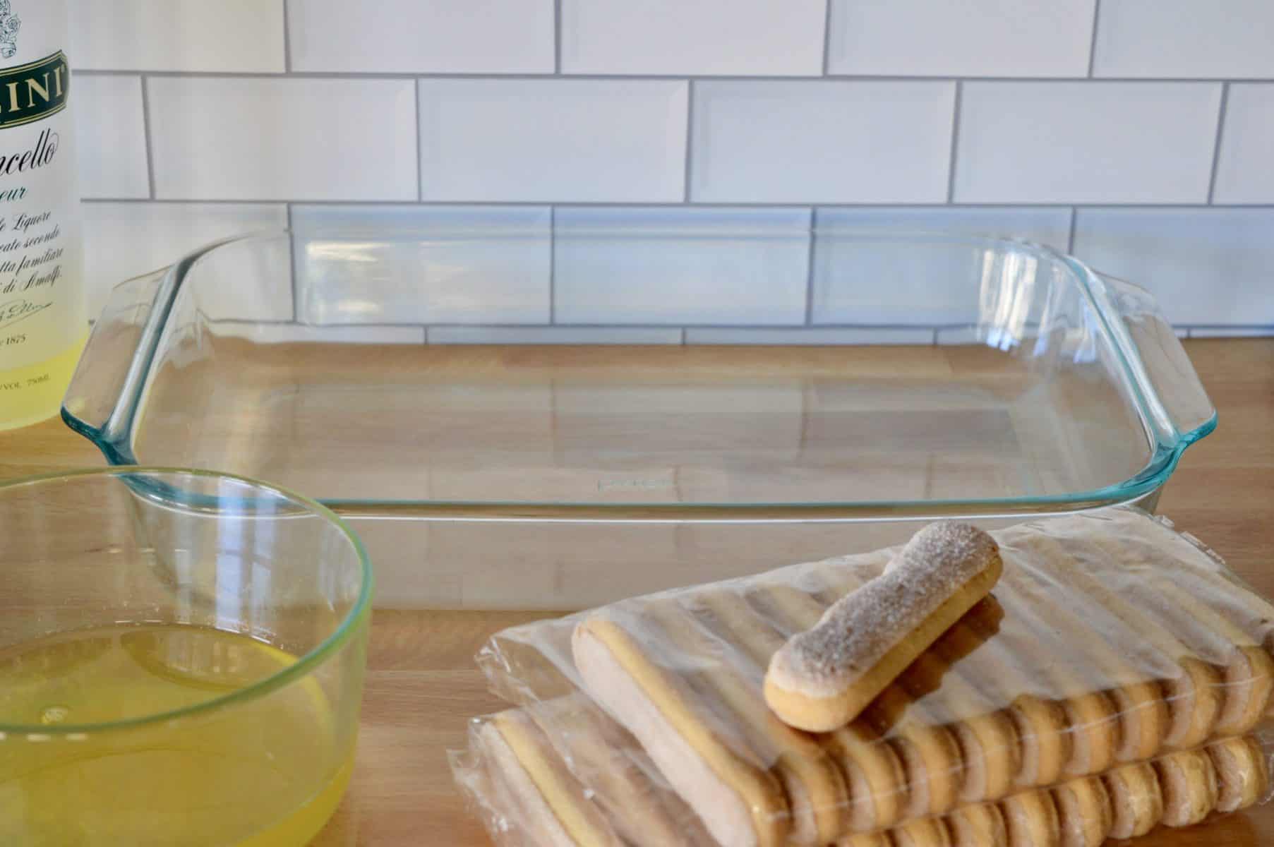 lemon soak and ladyfingers on a wood surface. 