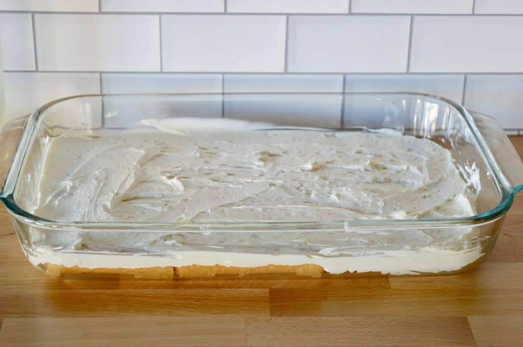 mascarpone layered on top of the bottom layer of soaked ladyfingers.