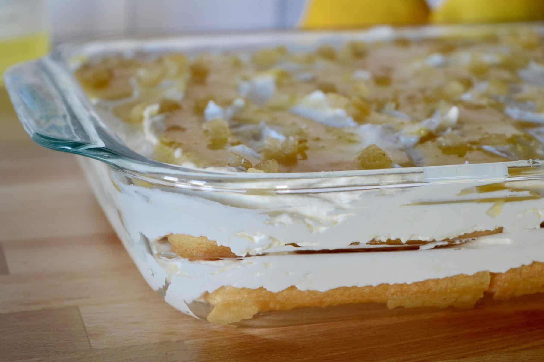 side view of limoncello tiramisu in a glass baking dish. 