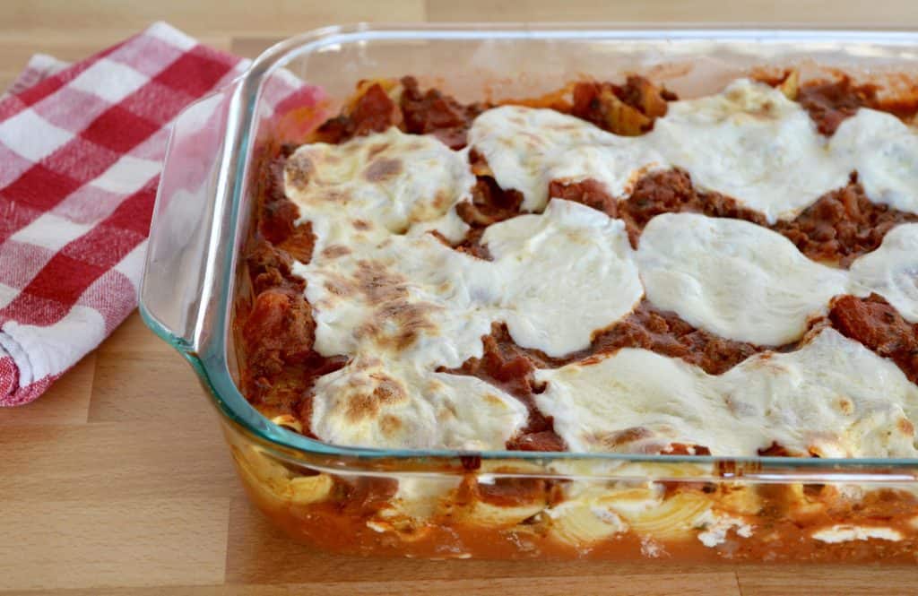 Cheese beef Stuffed Shells in a glass baking dish.