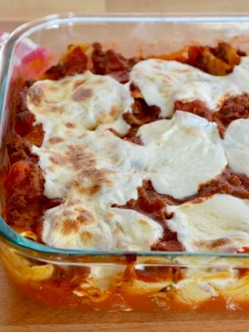 Cheese & Meat Stuffed Shells in a glass baking dish.