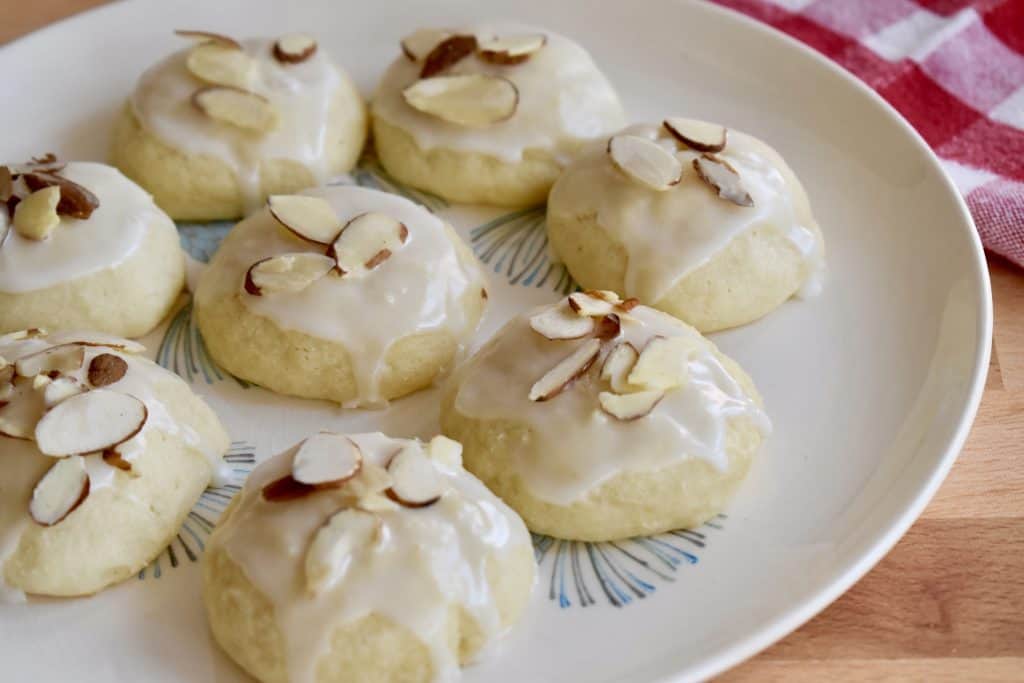 Italian Almond Ricotta Cookies on a white plate.