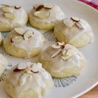 Italian Almond Ricotta Cookies on a white plate.