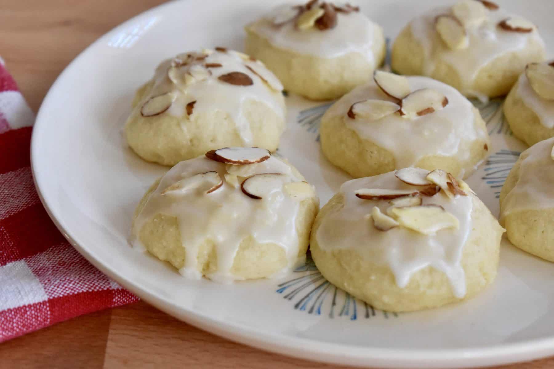 Italian Almond Ricotta Cookies on a white plate. 