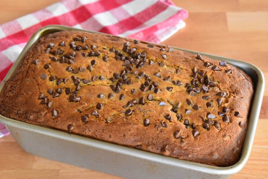 Baked loaf with chocolate chips sprinkled on top.