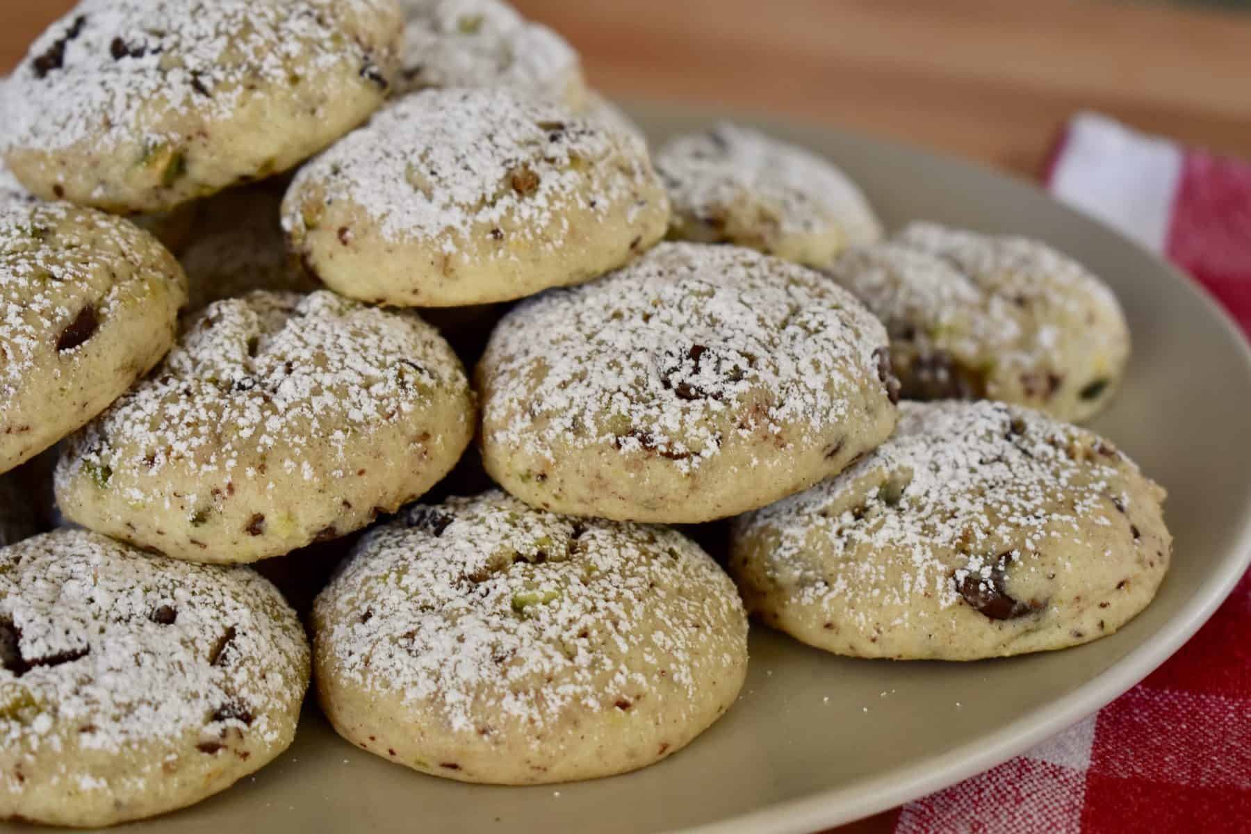 Cannoli Cookies stacked high on a plate. 