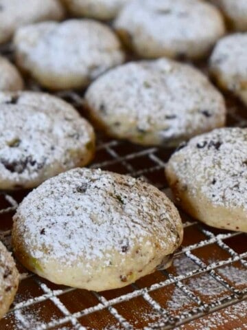 powdered sugar spindled on top of the cooled cookies on a baking rack.