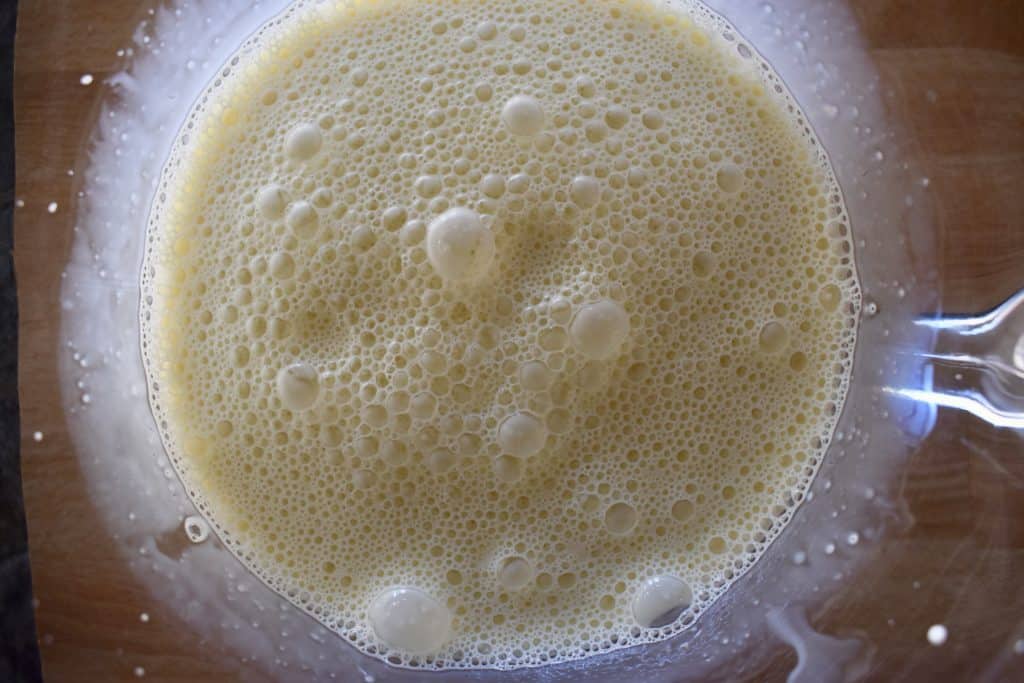 eggs, half and half, and vanilla whisked together in a glass bowl.
