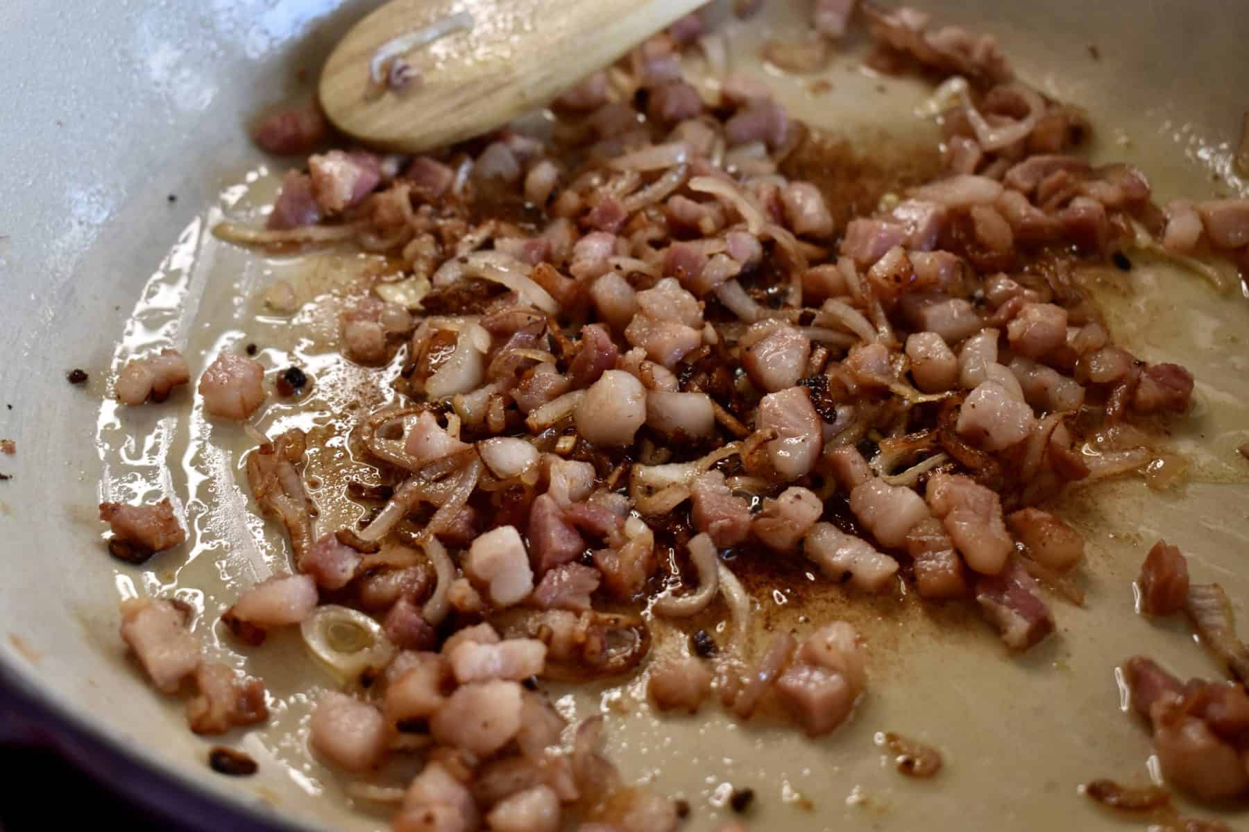 bacon and onions in the pan. 