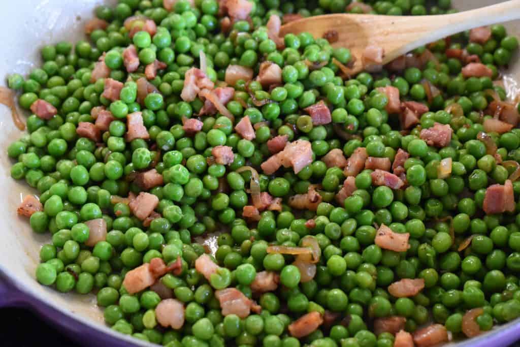 the recipe in a pan with a wooden spoon