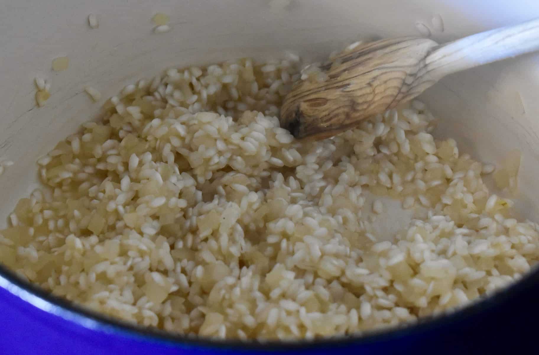 wine added to the arborio rice in a large pot.