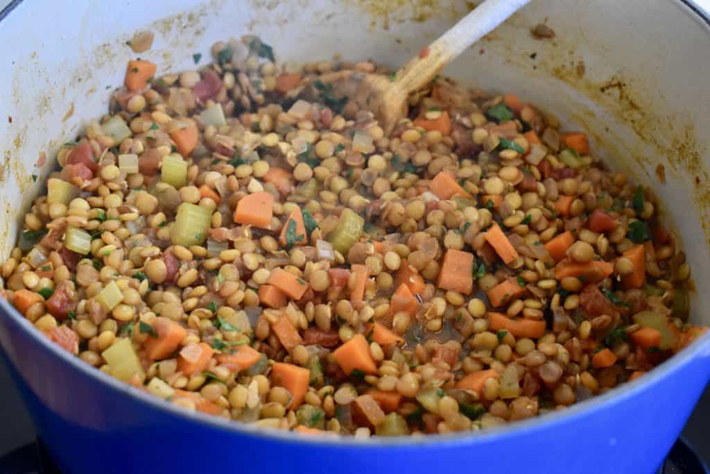Parsley stirred into the mixture.