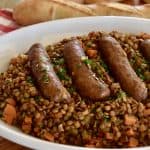 Italian Sausage and Lentils on a white serving platter.