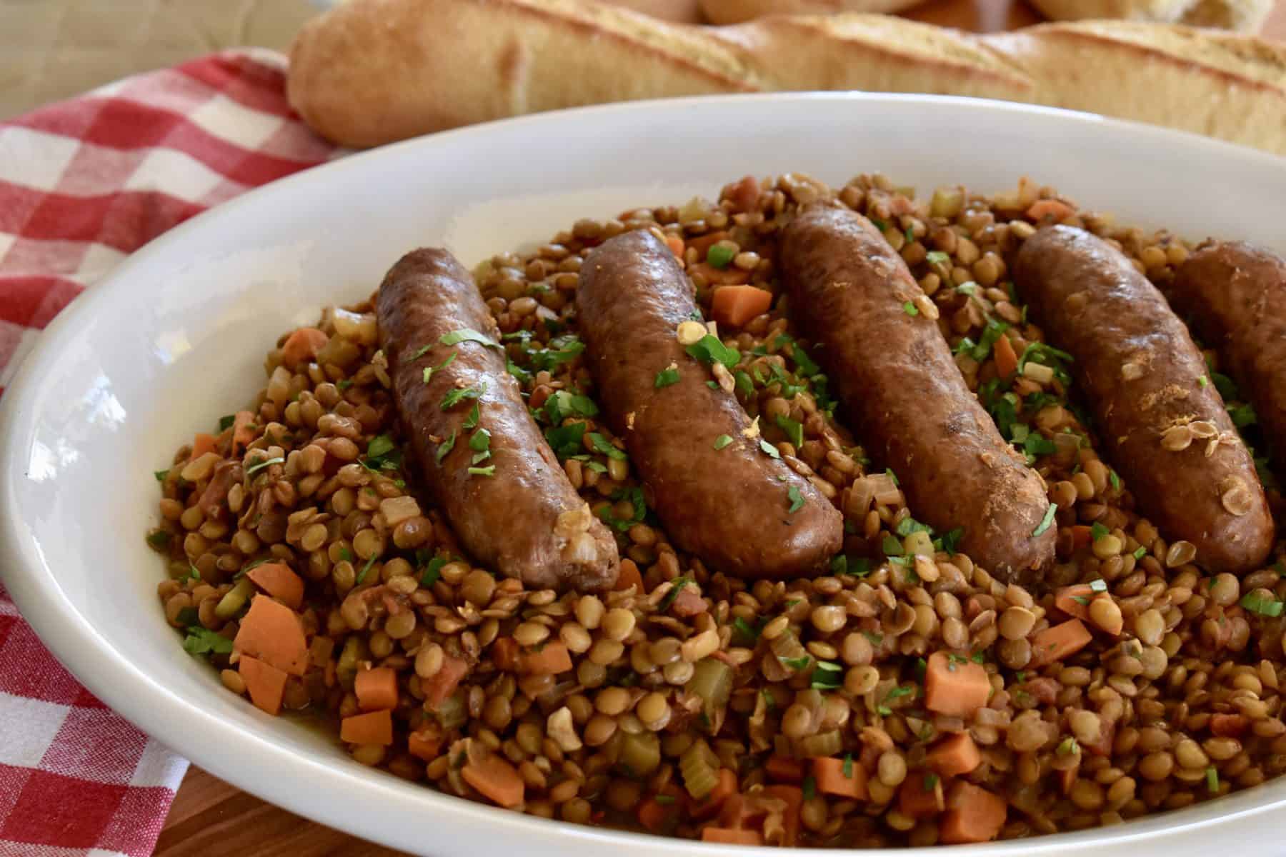 Italian Sausage and Lentils on a white serving platter. 