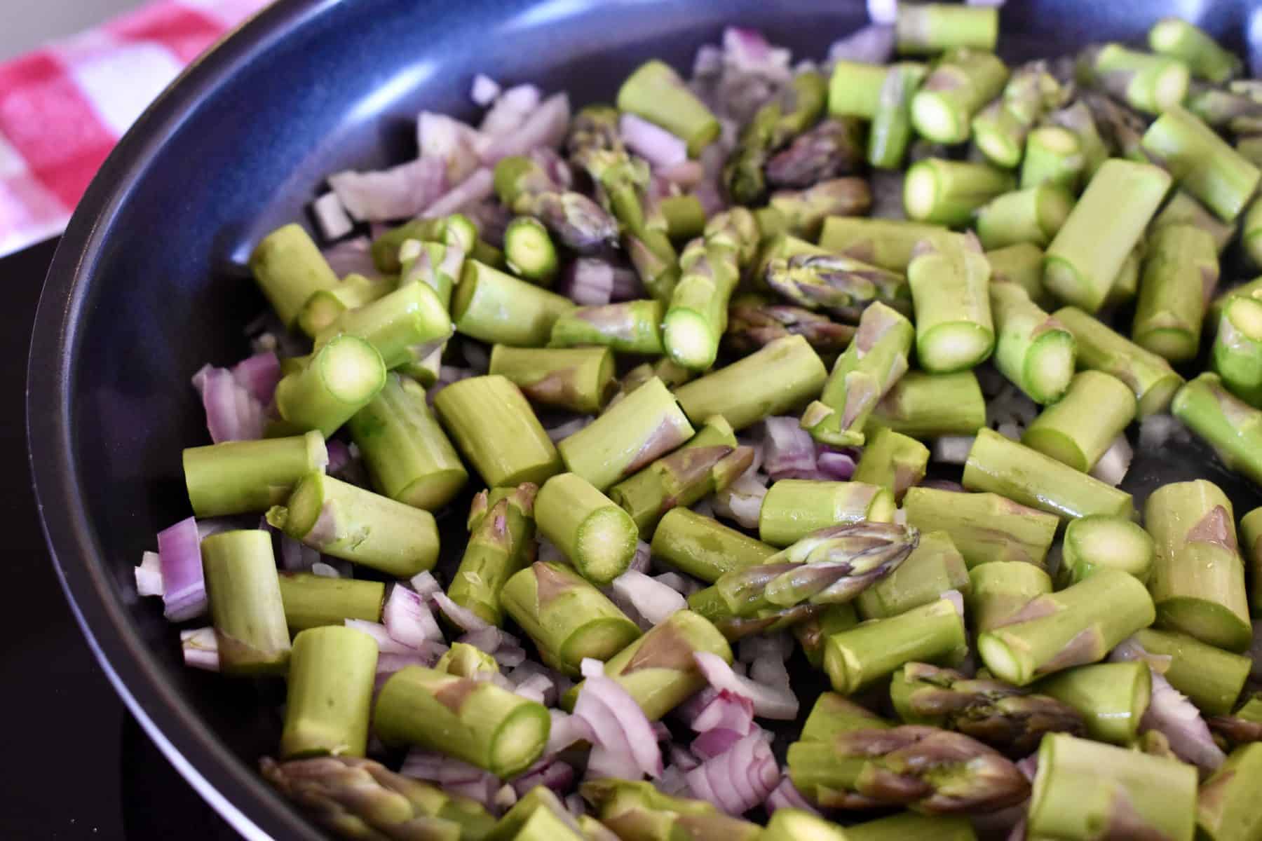 asparagus, shallots, and olive oil in a skillet. 