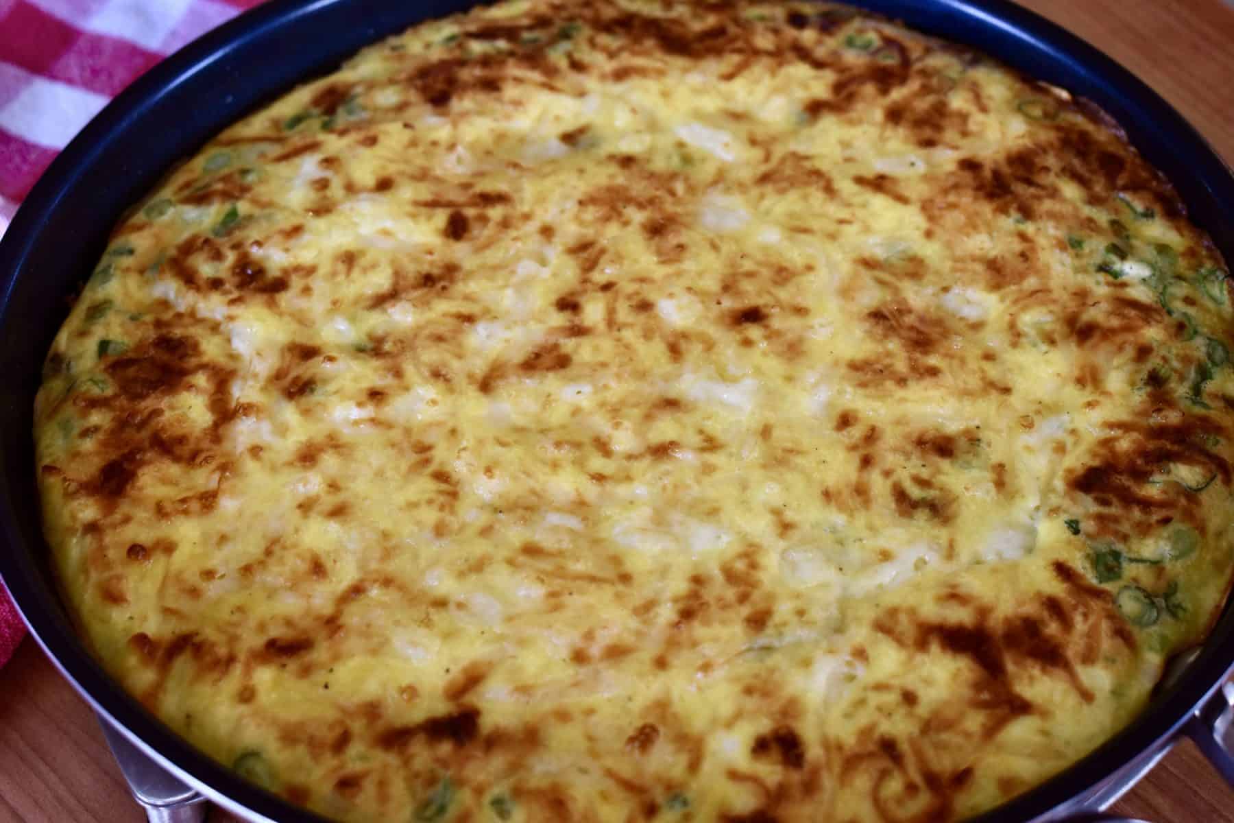 Asparagus Ricotta Frittata in a pan. 