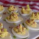 Italian Deviled Eggs on a white serving platter.