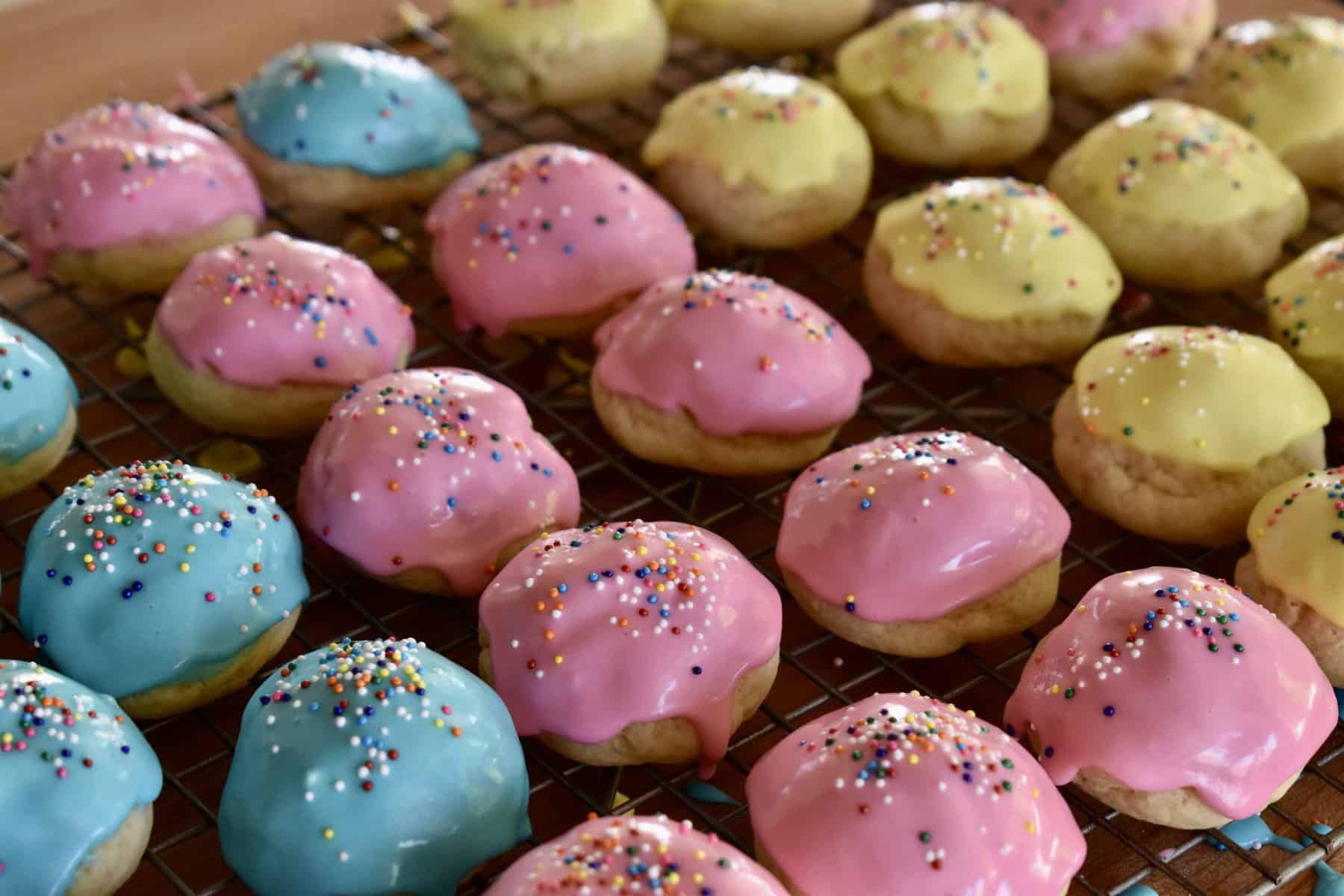 Italian Easter Cookies in pink, yellow, and blue.