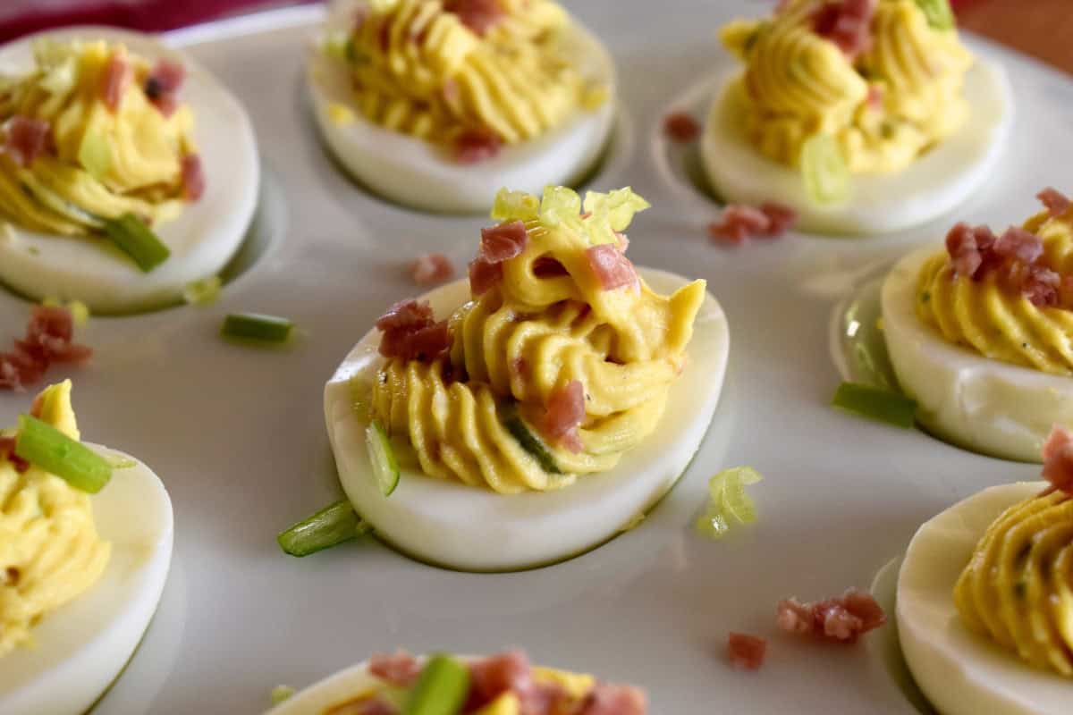 Italian Deviled Eggs on a white tray. 