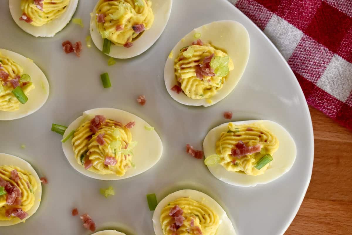 Italian Deviled Eggs on a white plate. 