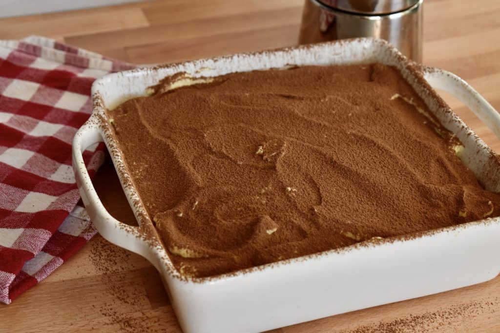 Cocoa powder dusted over top of the chilled tiramisu.