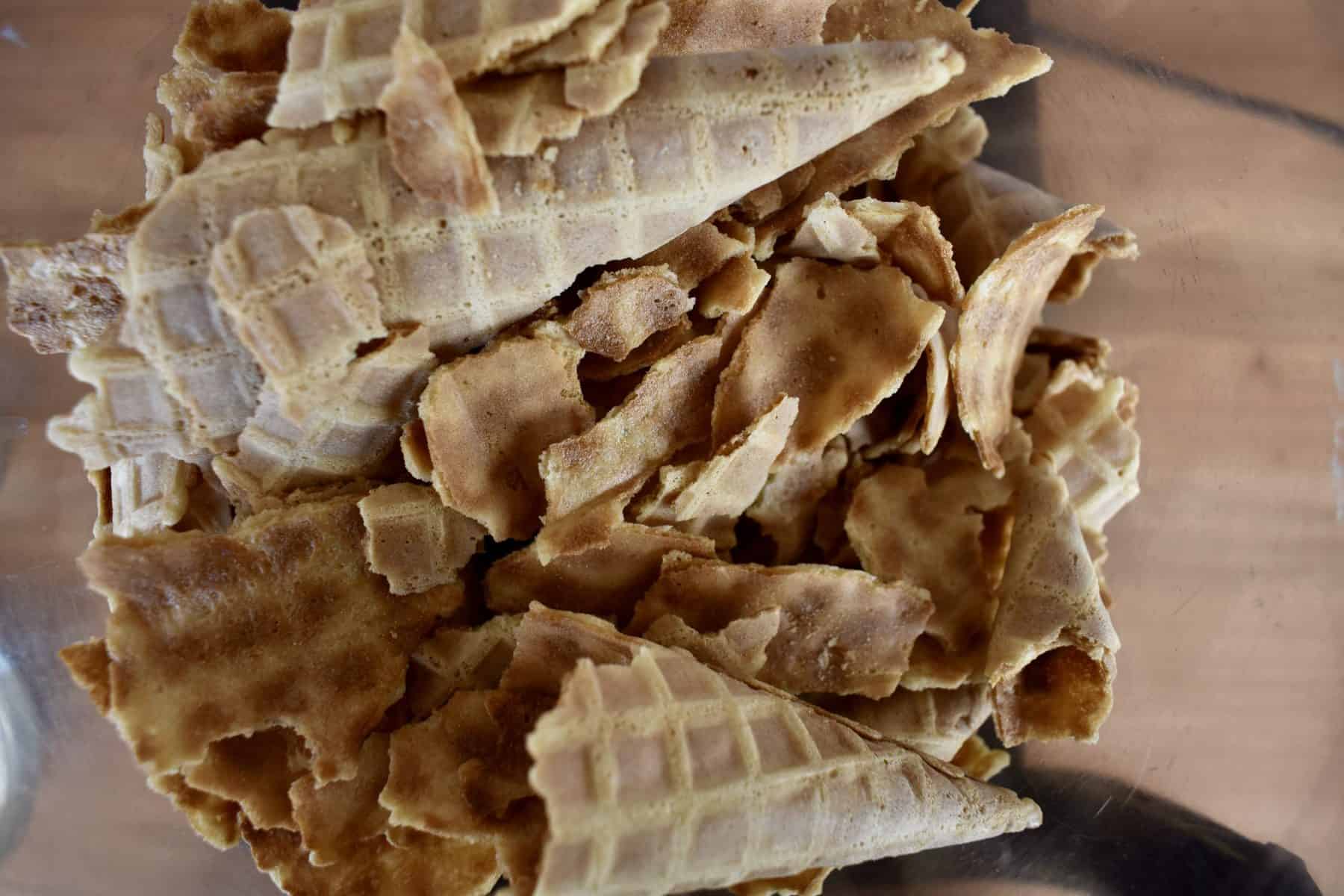 overhead photo of broken waffle cones in a food processor. 