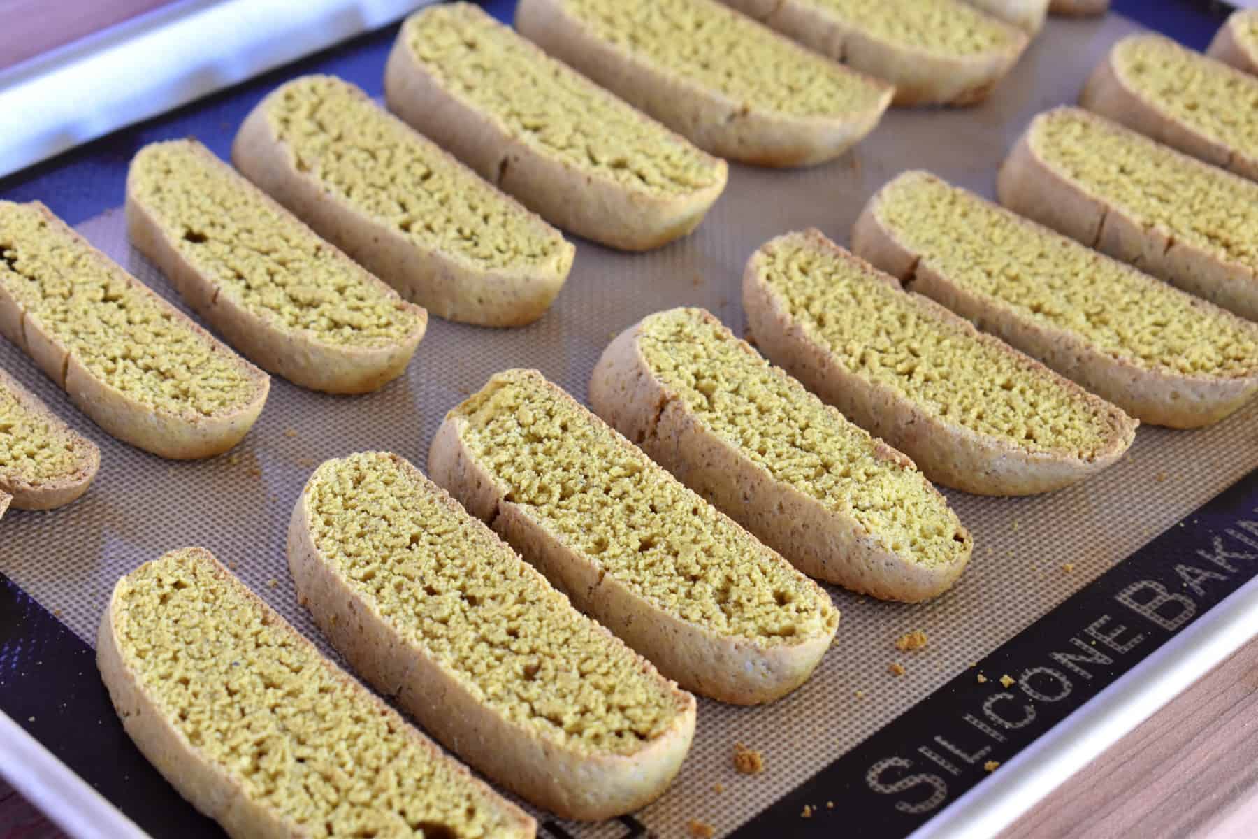 side angle view of biscotti on a baking sheet after their second bake. 