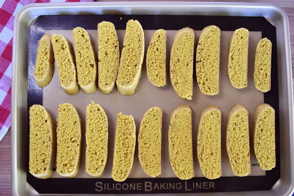 sliced biscotti on a baking mat. 