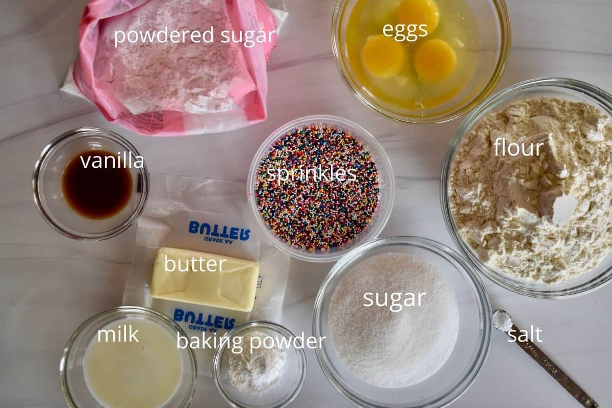 overhead photo of ingredients for taralli include flour, butter, baking powder, milk, vanilla, sugar, and salt. 