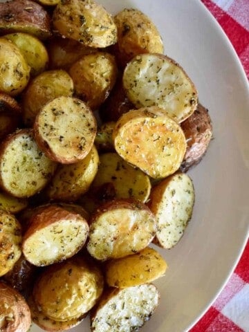 Italian Roasted Potatoes in a white bowl.