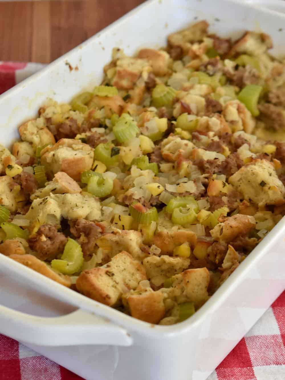 Focaccia Stuffing in a white serving dish on a checkered napkin. 