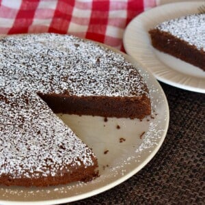 torta caprese is a delicious Italian flourless chocolate cake on a checkered napkin.