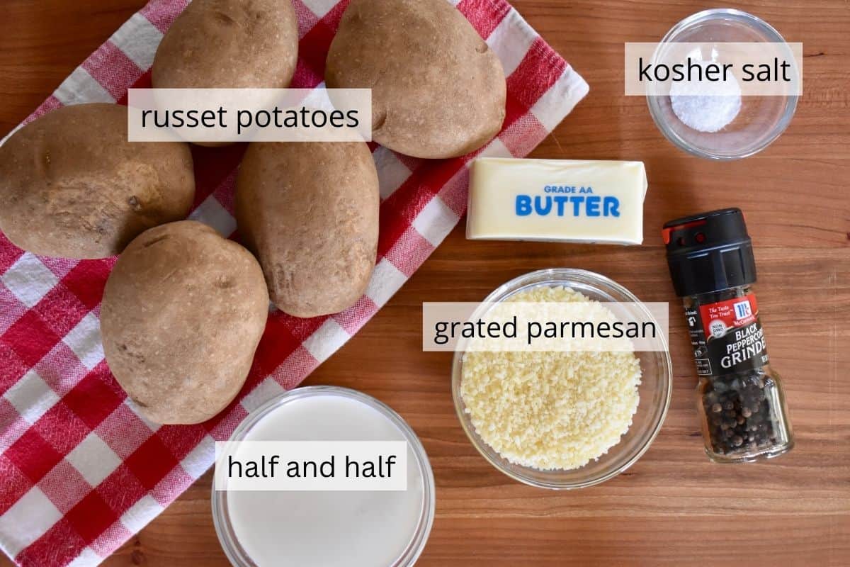 overhead photo of ingredients needed for recipe including parmesan cheese, pepper and butter. 