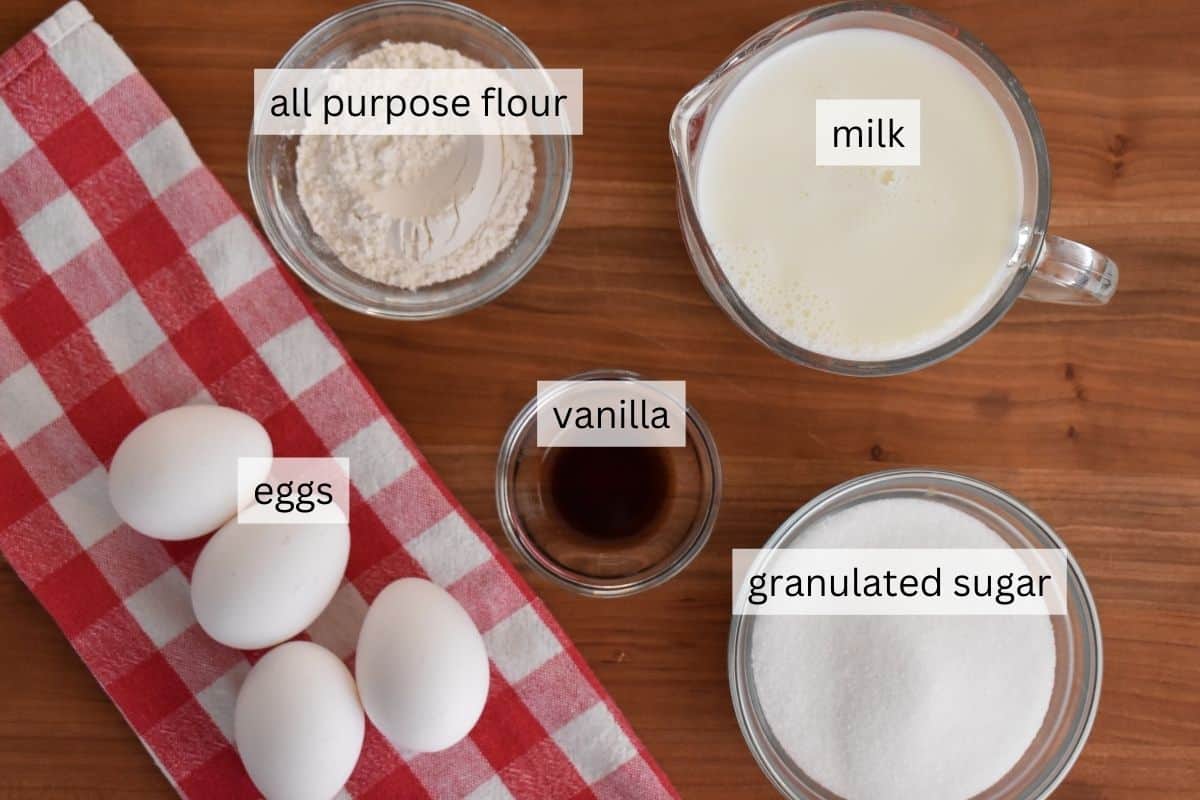 overhead photo of ingredients including eggs, flour, milk, flour, and sugar. 