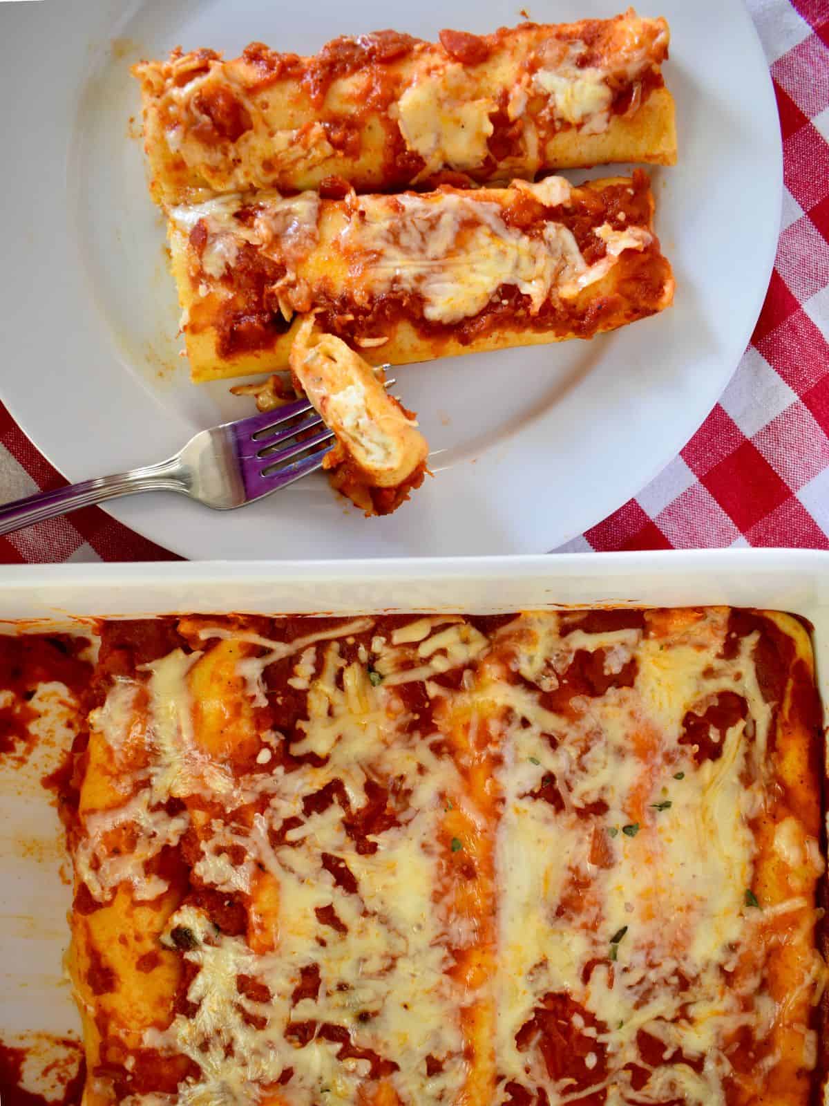 Manicotti Crepes in a white baking dish with a plate of manicotti next to it. 