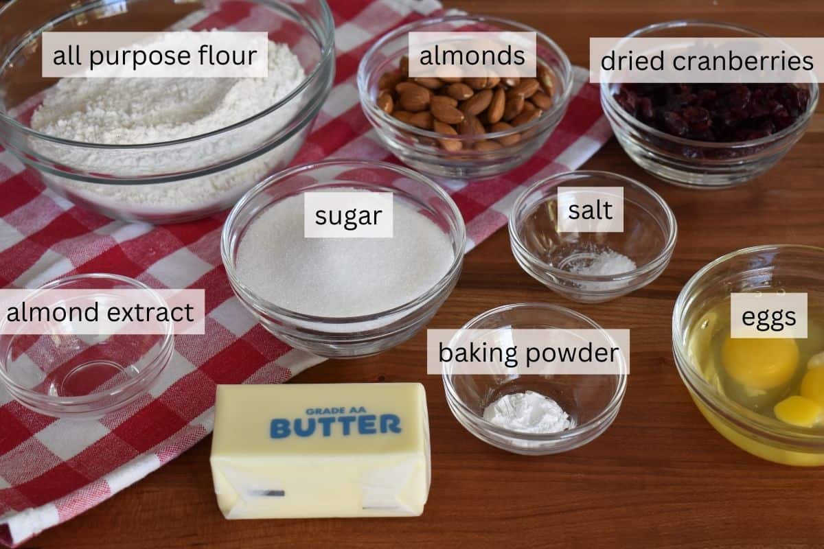 Ingredients for recipe including flour, baking powder, eggs, butter, and almond extract. 
