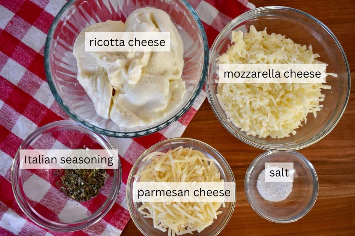 Ingredients needed for recipe including parmesan, mozzarella, salt, and Italian seasoning. 