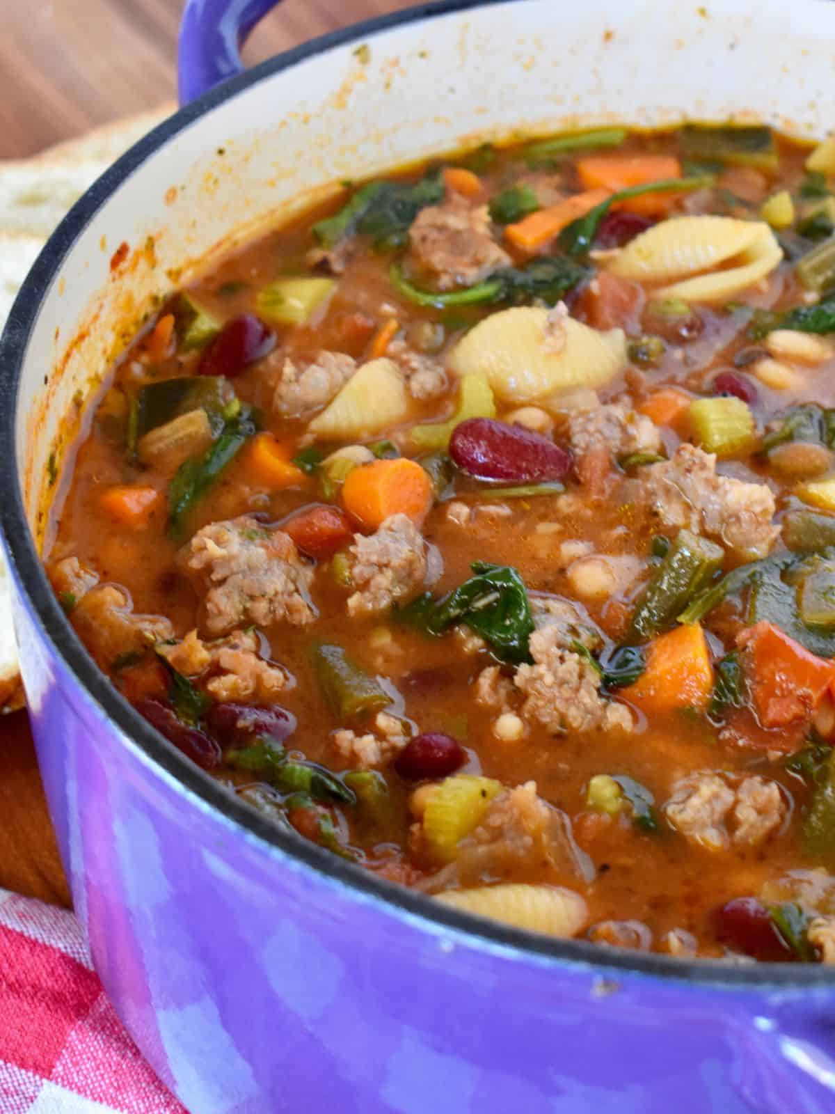 Pot of minestrone soup with sausage. 