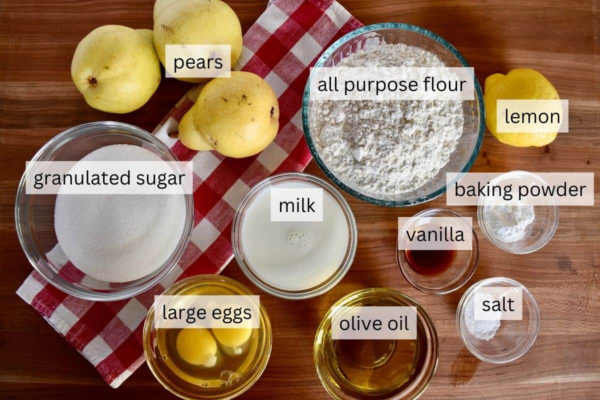 Ingredients for recipe including sugar, lemon, eggs, olive oil, and flour. 