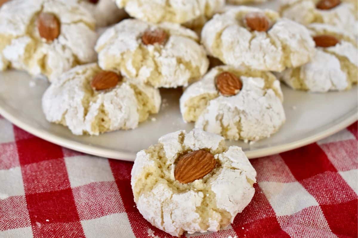 Sicilian Almond Cookies on a red and white checkered napkin. 