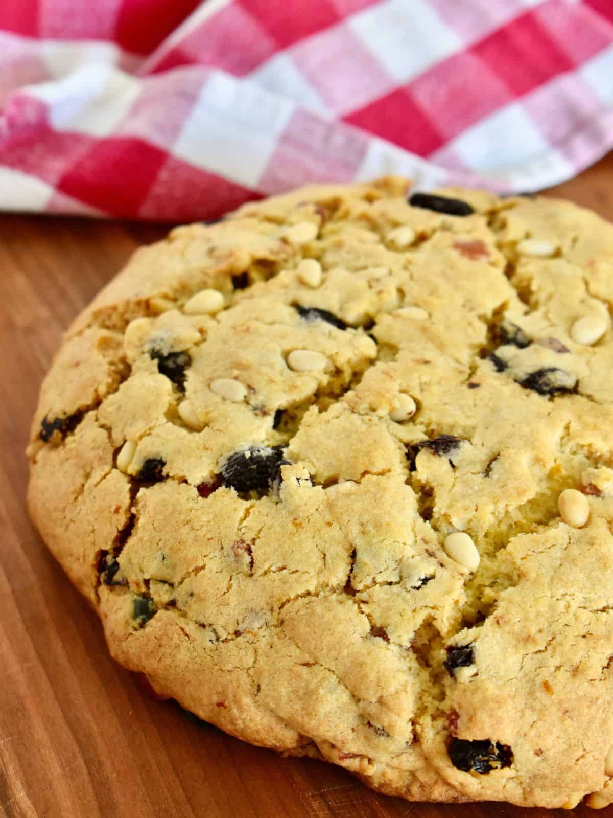 Pandolce on a countertop with a checkered napkin in the background.