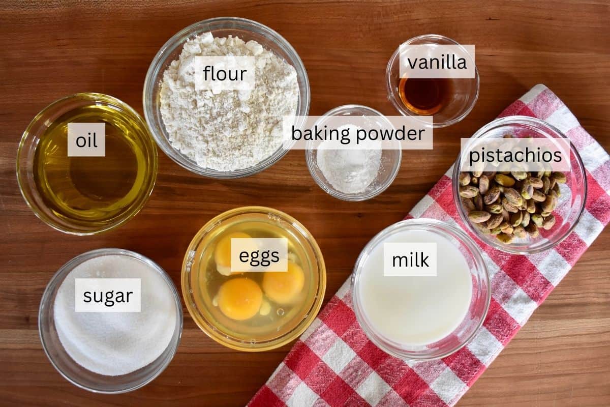 Ingredients on a counter including sugar, eggs, flour, and oil.
