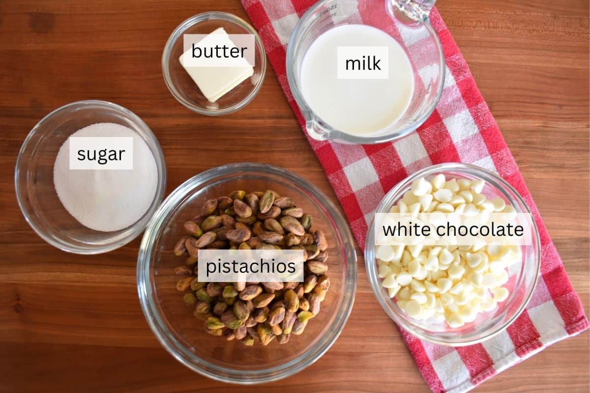 Ingredients for recipe including white chocolate, butter, nuts, sugar, and milk.
