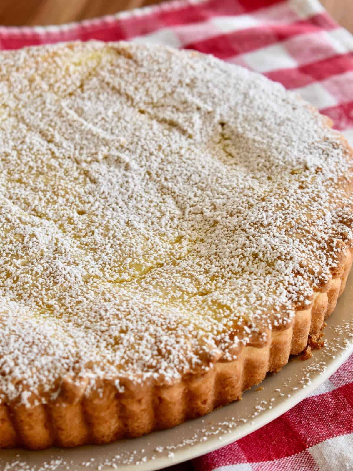Ricotta Pie with a dusting of powered sugar on top. 