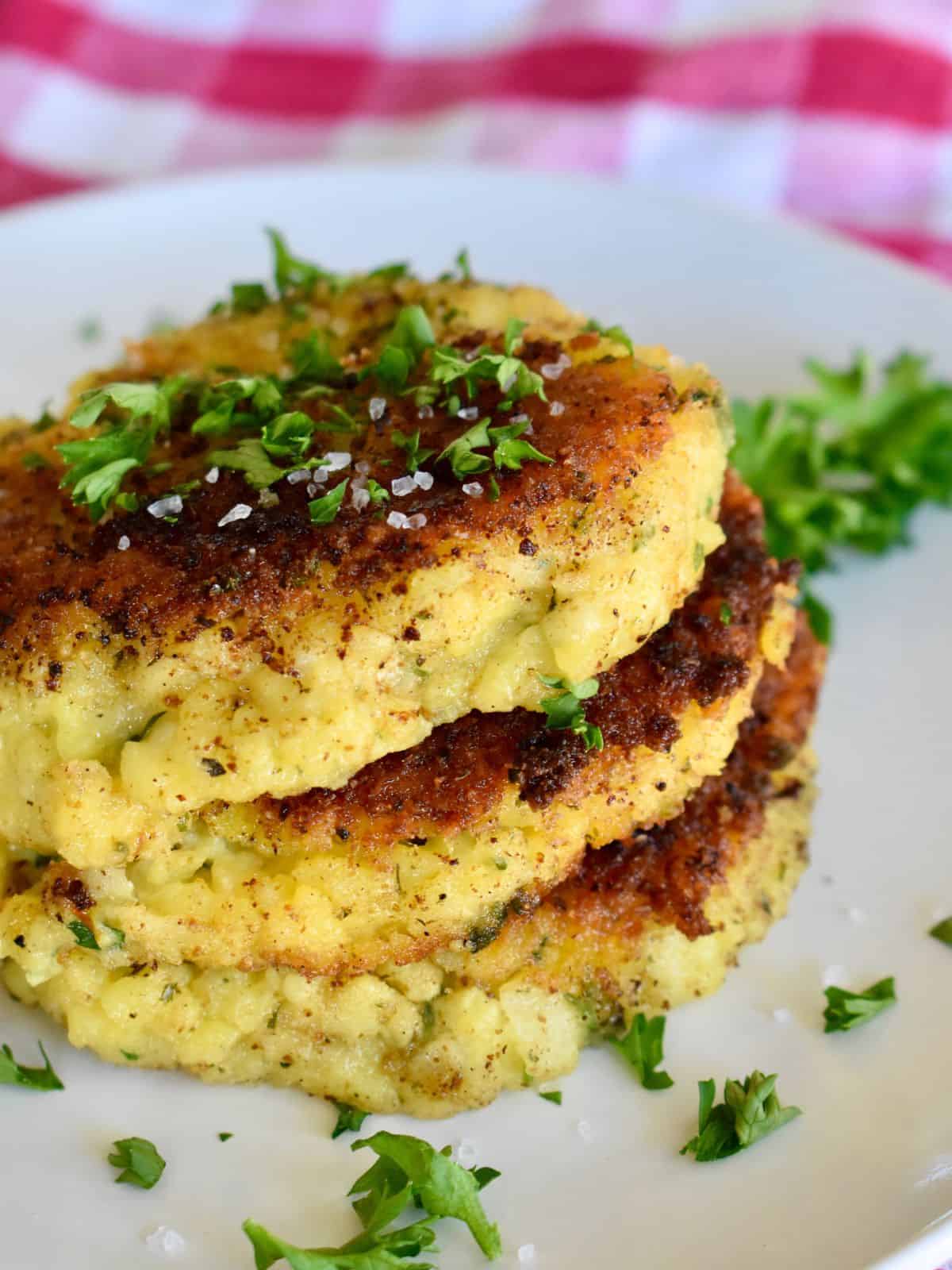 Risotto Cakes on a white plate. 